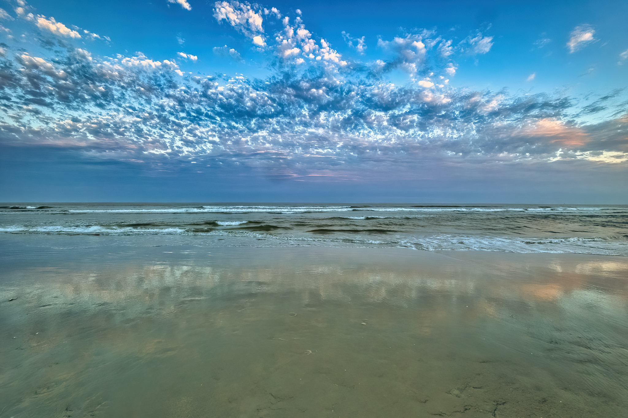 Beach sunset, sky, and reflections. Taken in Wildwood, New Jersey.