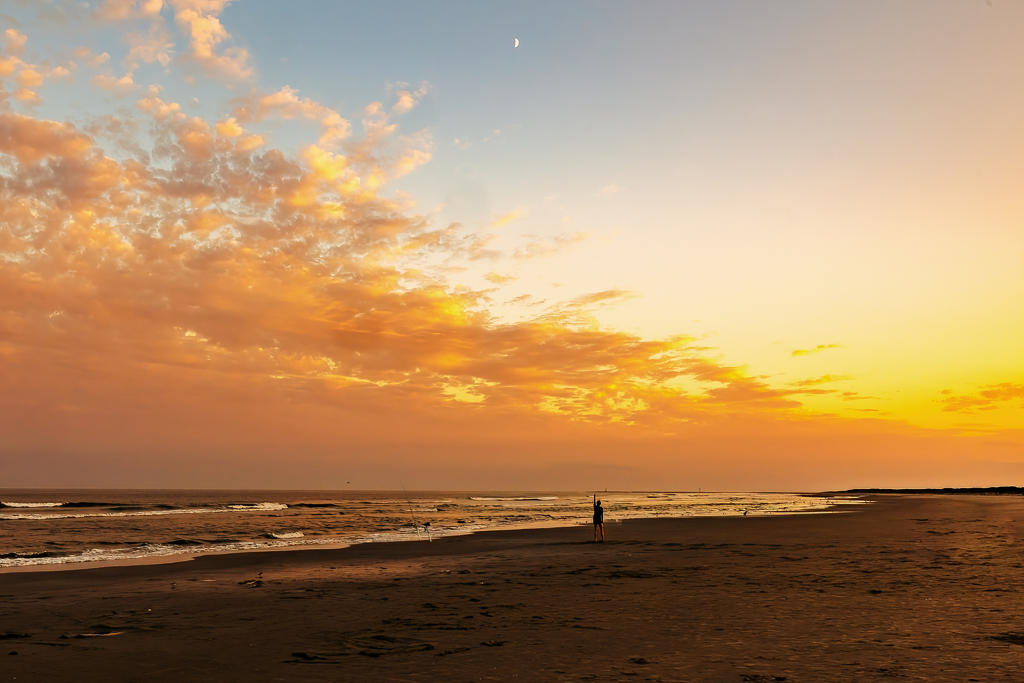 Beach sunset, ultra wide angle with kid pointing up at the moon. Taken in Wildwood, New Jersey.